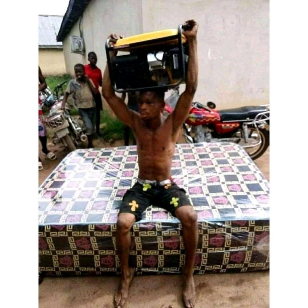 See The Thief Caught  and Made To Carry The Generator He Stole On His Head