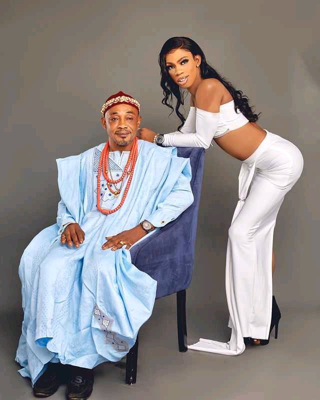 Nigerian Crossdresser James Brown Takes Photo with His Father As Governor's Aid Reacts