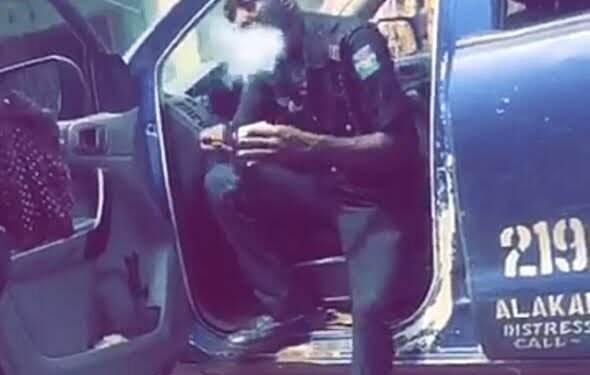 See the Face of Nigerian Police Officer Caught Smoking Weed As IG Orders Probe