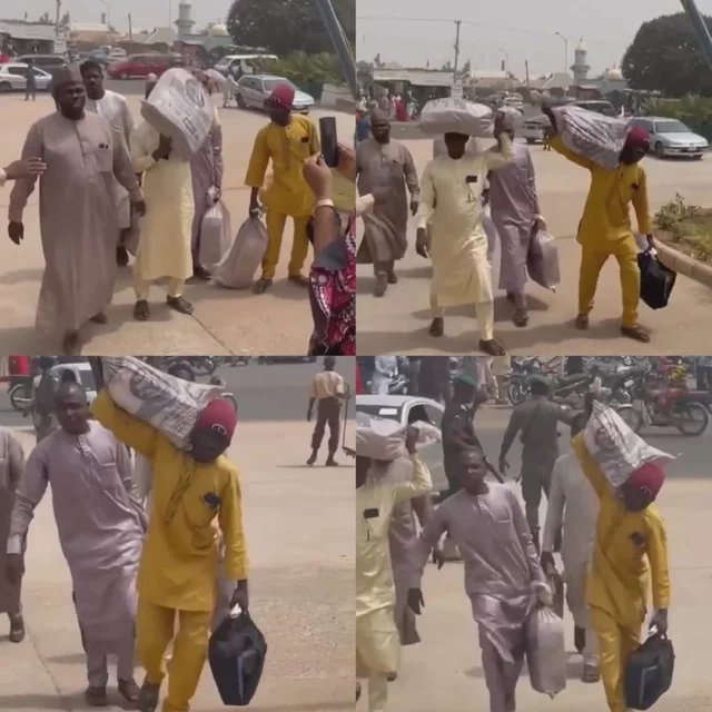 VIDEO: Nigerian Men Storm CBN Carrying N81m Sack of Old N1000 and N500 Notes (WATCH IT)