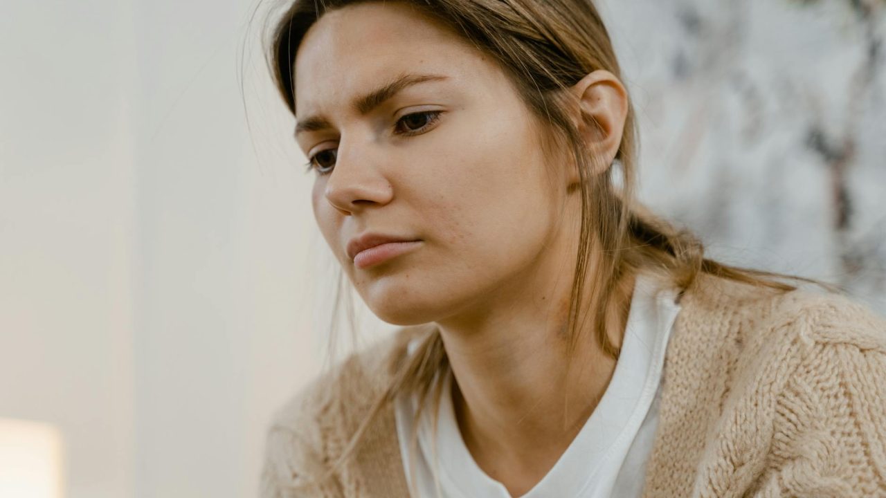 blonde sad woman looking down