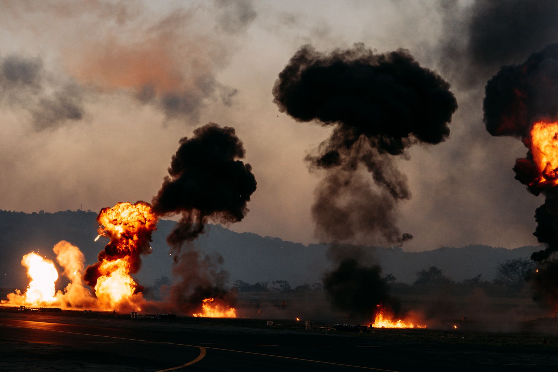 dramatic explosions and thick smoke outdoors
